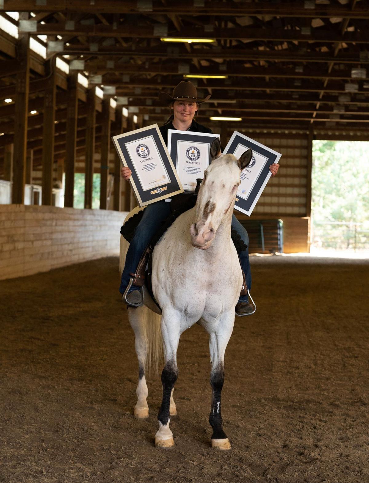 Morgan Wagner with "Endo the Blind" and his three Guinness World Record certificates. (Courtesy of Brittany Hirst Photography/GUINNESS WORLD RECORDS)