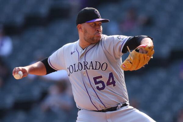 Carlos Estevez (54) of the Colorado Rockies delivers a pitch during the seventh inning against the Chicago White Sox at Guaranteed Rate Field in Chicago, on Sept. 14, 2022. (Michael Reaves/Getty Images)