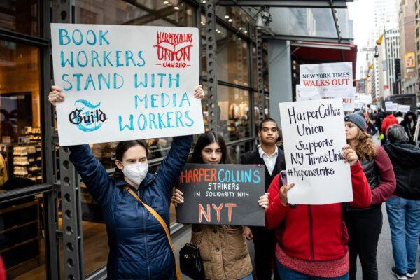 Reporters, editors, and other employees at The New York Times take part in a walkout demanding increases in salaries and benefits at the New York Times building in New York City on Dec. 8, 2022. (Samira Bouaou/The Epoch Times)