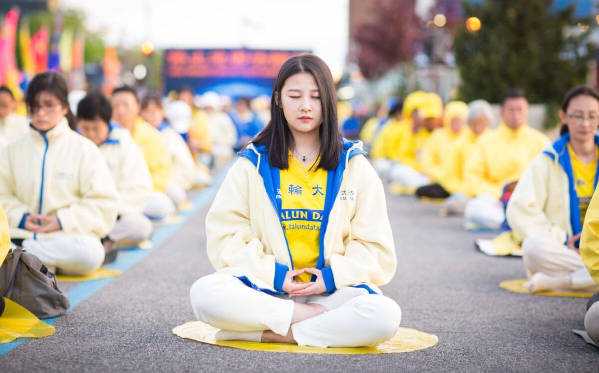 Hundreds of Falun Gong practitioners hold a vigil near the Chinese Consulate in New York for World Falun Dafa Day on May 11, 2017. (The Epoch Times)