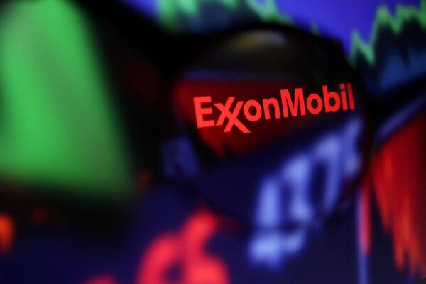 Exxon Mobil logo and stock graph are seen through a magnifier displayed in this illustration taken on Sept. 4, 2022. (Dado Ruvic/Illustration/Reuters)