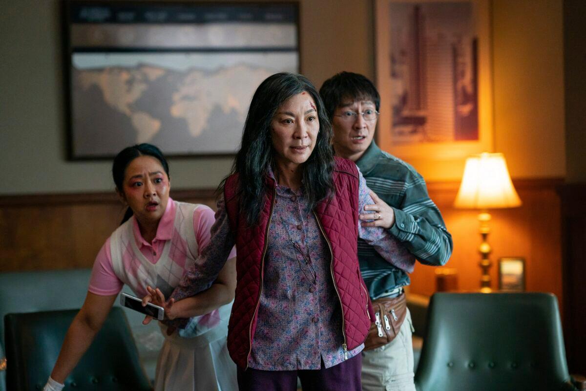 (L–R) Stephanie Hsu, Michelle Yeoh, and Ke Huy Quan in a scene from "Everything Everywhere All At Once.". (Allyson Riggs/A24 Films via AP)