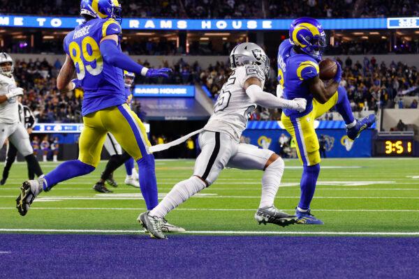 Cam Akers (3) of the Los Angeles Rams makes a reception against Tre'von Moehrig (25) of the Las Vegas Raiders during the fourth quarter at SoFi Stadium in Inglewood, Calif., on Dec. 8, 2022. (Ronald Martinez/Getty Images)