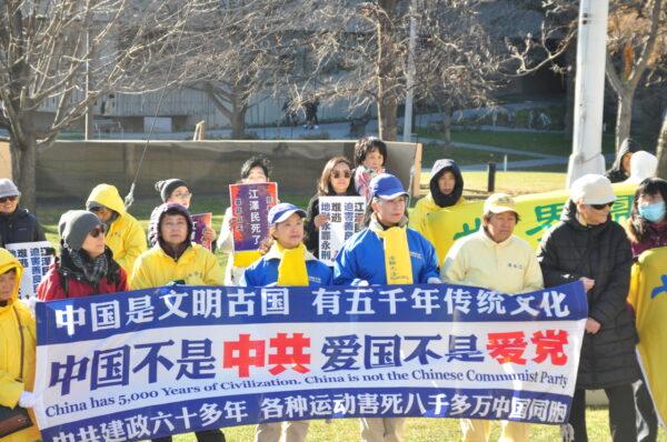 Adherents of the spiritual practice Falun Gong hold a banner at a rally in Queen's Park, Toronto, on Dec. 8, as they voiced support for a bill that would ban forced organ harvesting, and called out the Chinese regime's human rights abuses. (Allen Zhang/The Epoch Times)