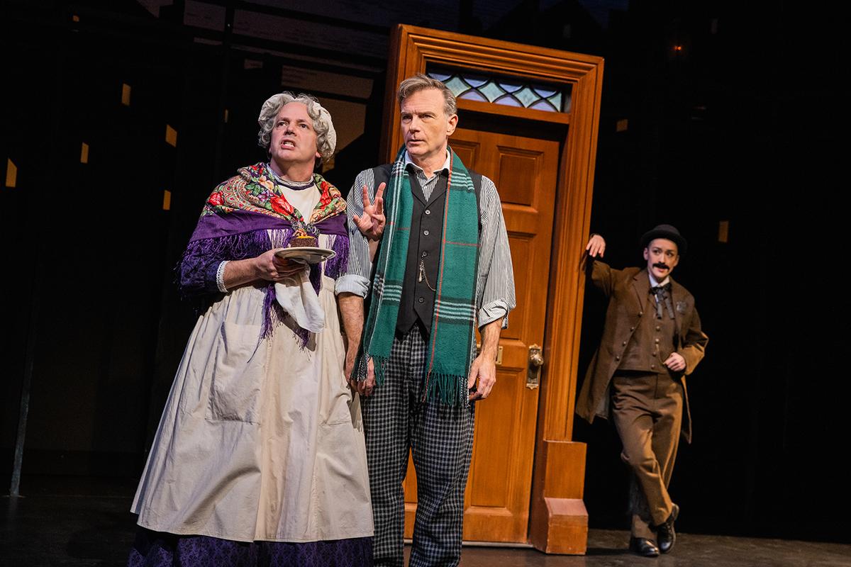 (L–R) Mark Price playing a secondary character, Drew McVety as Sherlock Holmes, and Joanna Carpenter as Inspector Lestrade. (Evan Zimmerman)