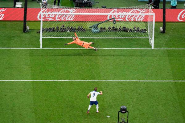 England's Harry Kane misses a penalty shot sending the ball over the bar as France's goalkeeper Hugo Lloris dives during the World Cup quarterfinal soccer match between England and France, at the Al Bayt Stadium in Al Khor, Qatar, on Dec. 10, 2022. (Pavel Golovkin/AP Photo)