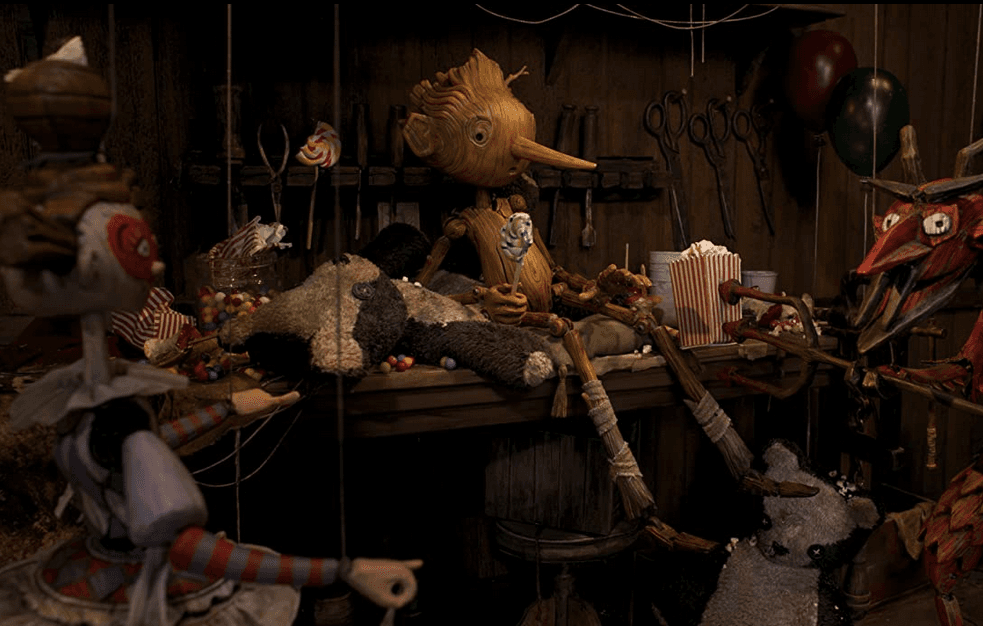 Pinocchio and this fellow showbiz puppets, in Guillermo del Toro's "Pinocchio." (Netflix)