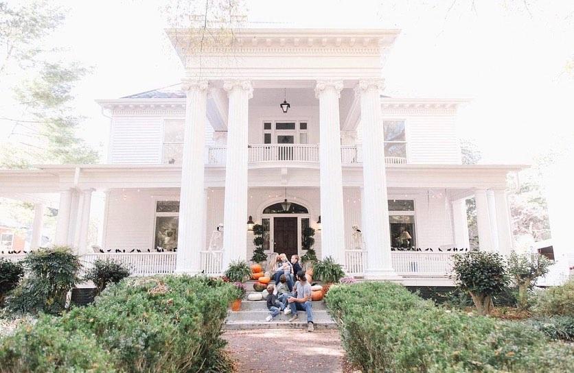 The Millers enjoy autumn on the front porch after restoration. (Courtesy of <a href="https://www.instagram.com/oldhouseadam/">Adam Miller</a>)