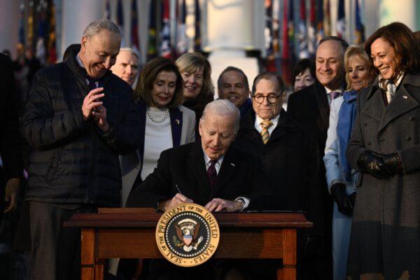 President Joe Biden signs the Respect for Marriage Act on the South Law of the White House on Dec. 13, 2022. (Brendan Smialowski/AFP via Getty Images)