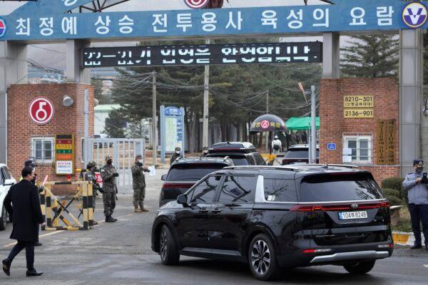 A convoy of vehicles, one of them carrying K-pop band BTS's member Jin arrive at an army training center in Yeoncheon, South Korea, on Dec. 13, 2022. (Ahn Young-joon/AP Photo)