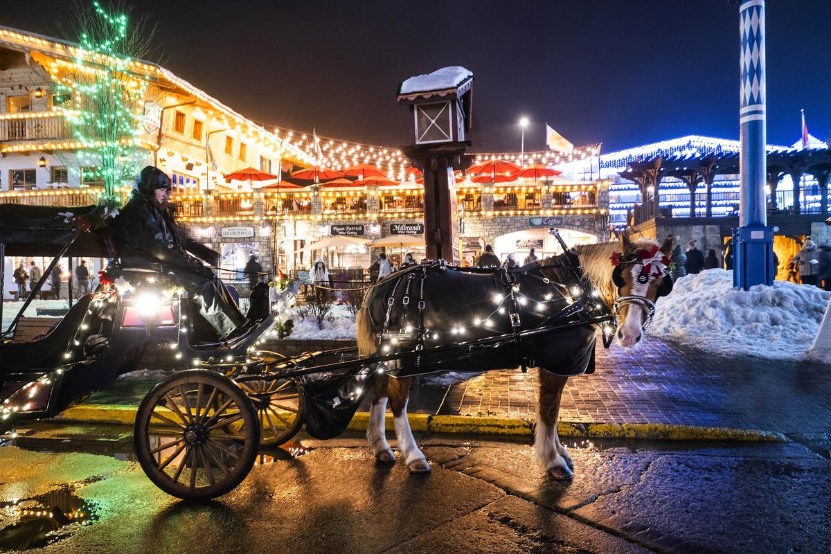 A horse and carriage is lit up in downtown Leavenworth, offering rides through the city's streets Saturday, Jan. 30, 2021. (Dean Rutz/The Seattle Times/TNS)