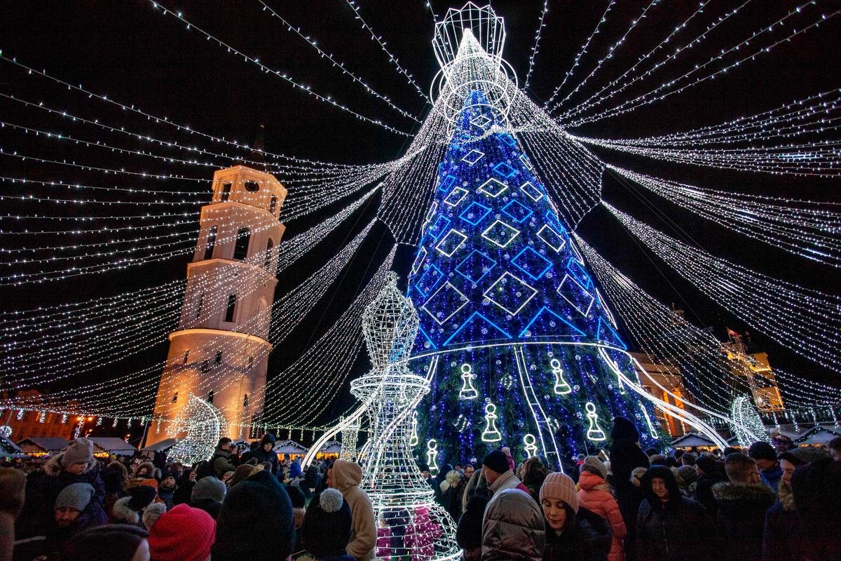 A picture taken on Nov. 30, 2019, shows an illuminated Christmas tree displayed outside the Cathedral during a lighting ceremony in Vilnius. (Photo by PETRAS MALUKAS/AFP via Getty Images)
