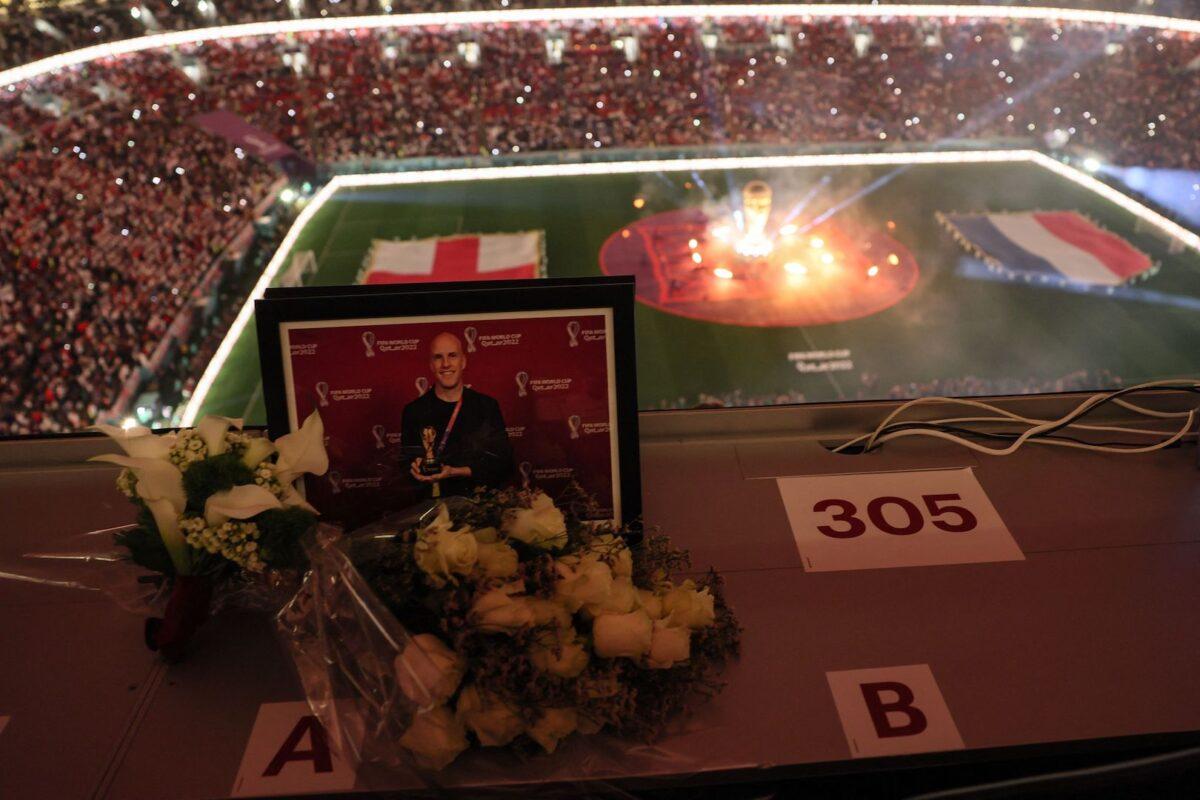 A tribute for American journalist Grant Wahl, who died after he collapsed in the stadium's press area while covering the match between Argentina and Netherlands, can be seen in the media tribune ahead of the Qatar 2022 World Cup quarter-final football match between England and France at the Al-Bayt Stadium in Al Khor, north of Doha, on Dec. 10, 2022. (Jack Guez/AFP via Getty Images)