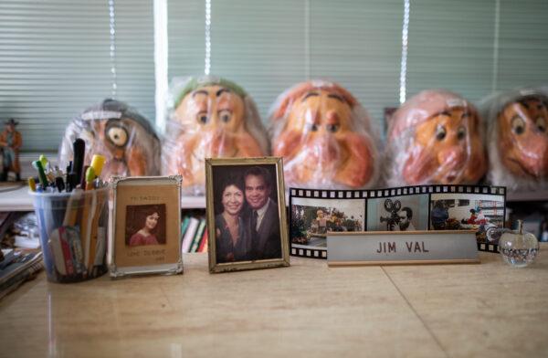 Desktop photos sit on the desk of James "Jim" Val at his home in Arcadia, Calif., on Dec. 9, 2022. (John Fredricks/The Epoch Times)