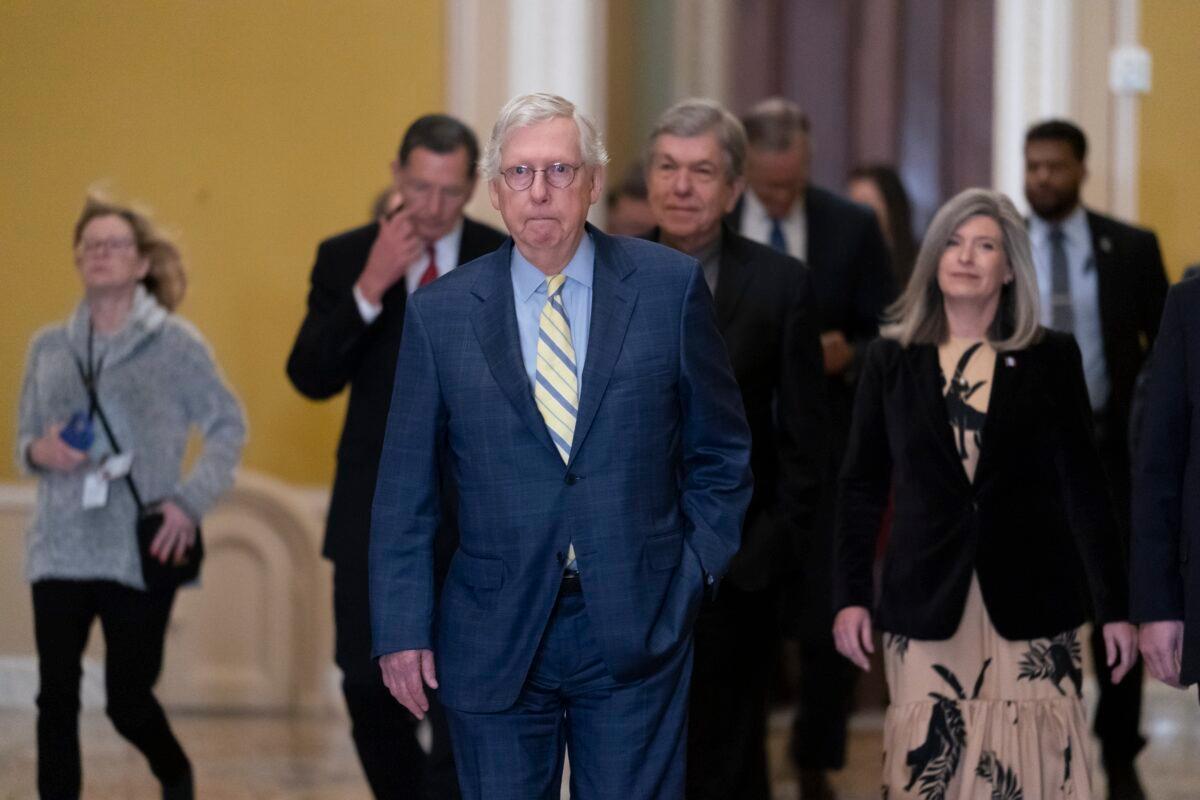 Senate Republican Leader Mitch McConnell, (R-Ky.), and his leadership team arrive to speak to reporters following a closed-door policy meeting, at the Capitol in Washington on Dec. 13, 2022. (J. Scott Applewhite/AP Photo)
