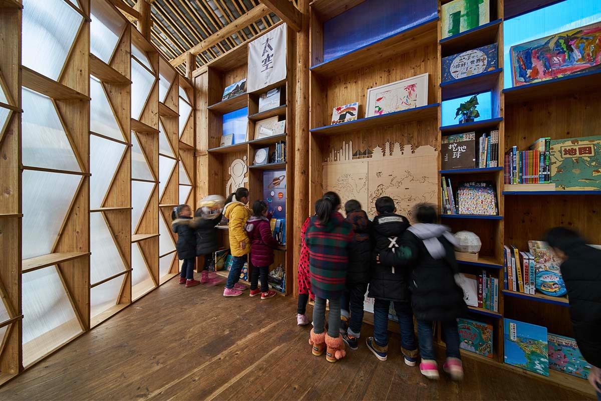 Children look at books and activities inside the ‘Pingtan Children’s library.’ Located in a Dong minority village, Pingtan township, Hunan province, China in an undated photo. (Courtesy of CUHK)