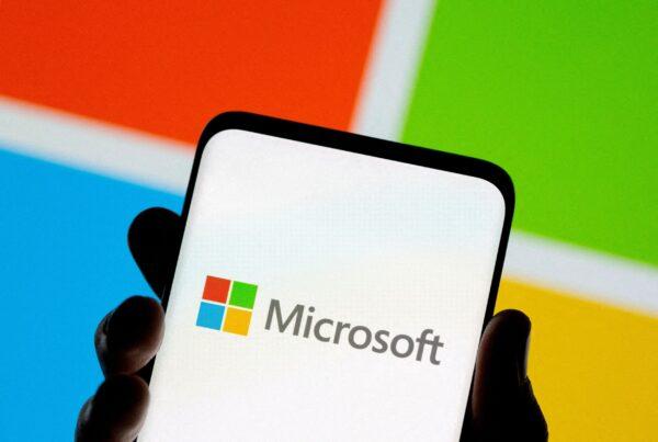 A smartphone in front of Microsoft logo on July 26, 2021. (Dado Ruvic/Reuters)