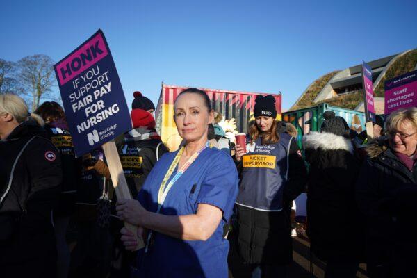 Members of the Royal College of Nursing (RCN) on the picket line outside the Alder Hey Children's Hospital in Liverpool as nurses in England, Wales, and Northern Ireland take industrial action over pay, on Dec. 15, 2022. (Peter Byrne/PA Media)