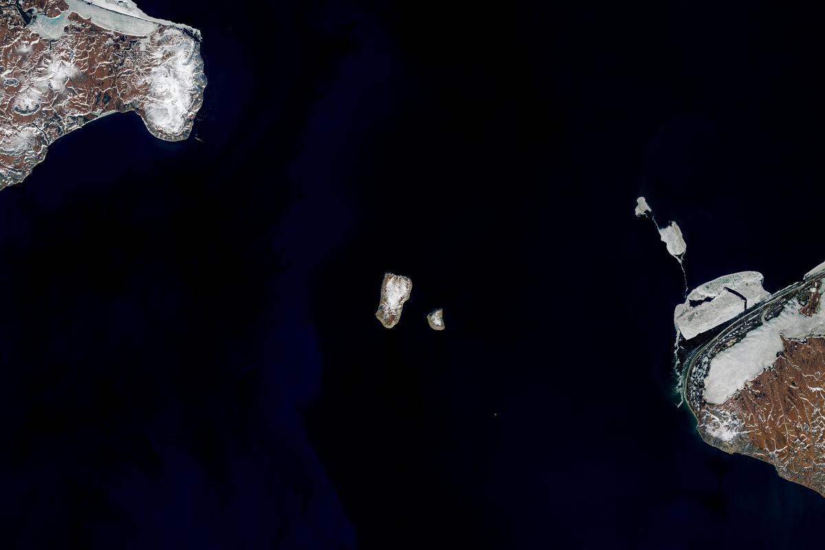 Tomorrow Island (Big Diomede) and Yesterday Island (Little Diomede) in the Bering Sea. (Joshua Stevens/NASA)