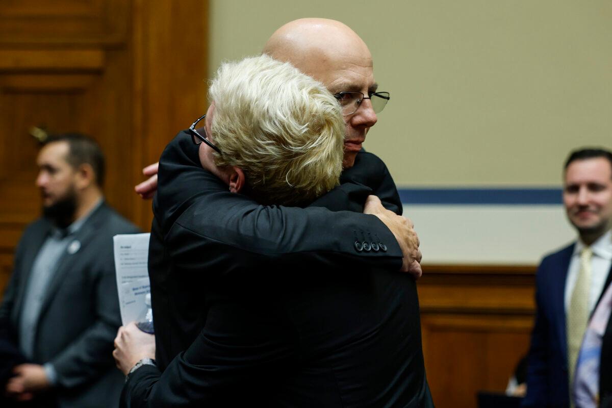 Matthew Haynes, the owner of Club Q, hugs Michael Anderson, a survivor of the Club Q shooting in Colorado Springs after speaking at the House Oversight Committee hearing titled "The Rise of Anti-LGBTQI+ Extremism and Violence in the United States" in Washington on Dec. 14, 2022. (Anna Moneymaker/Getty Images)