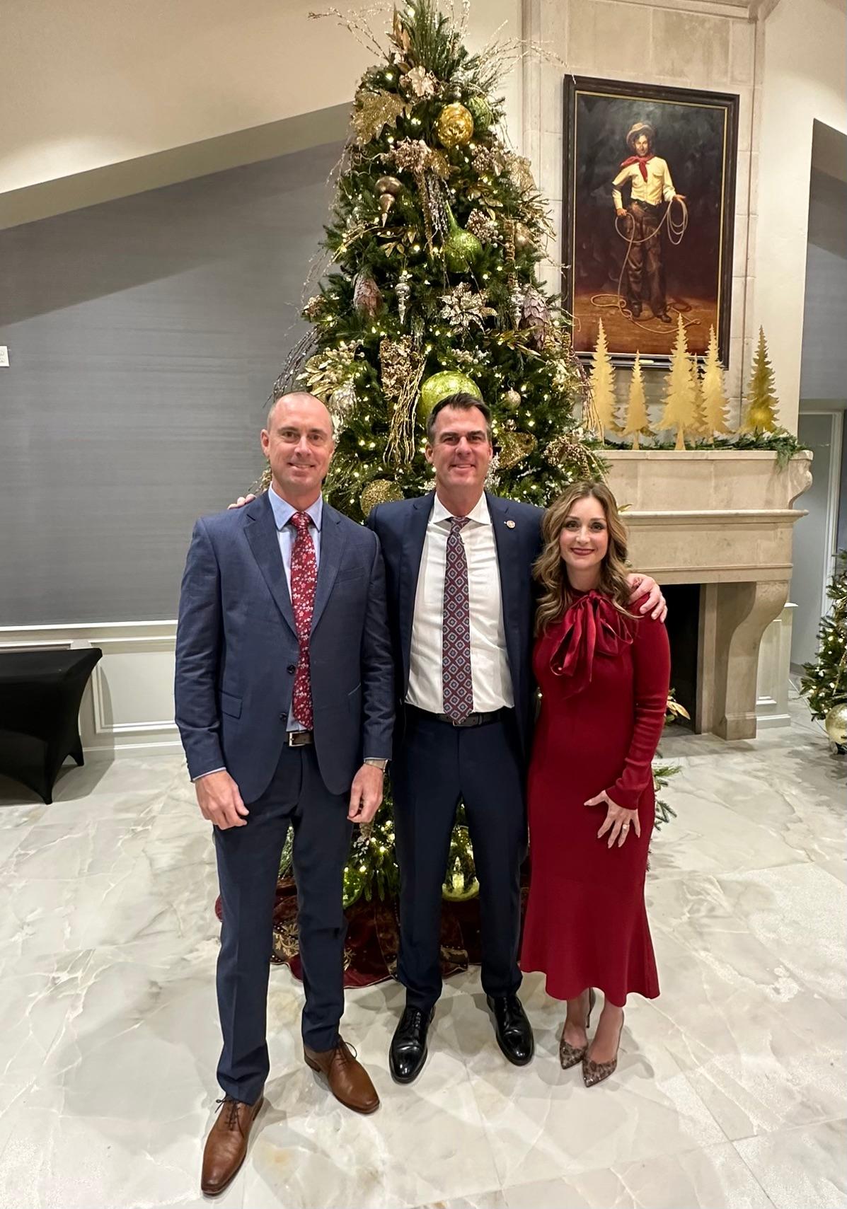 Activist Chris Elton (Left) with Oklahoma governor Kevin Stitt (Center) and First Lady Sarah Stitt (Right) at a Christmas party in Oklahoma City, Oklahoma in December, 2022. (Courtesy of Billboard Chris)