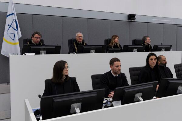 Presiding judge Mappie Veldt-Foglia, top, (2nd R), prepares to read the verdict in the case of Salih Mustafa, a former Kosovo rebel, at the Kosovo Specialist Chambers court in The Hague, Netherlands, on Dec. 16, 2022. (Peter Dejong/AP Photo)
