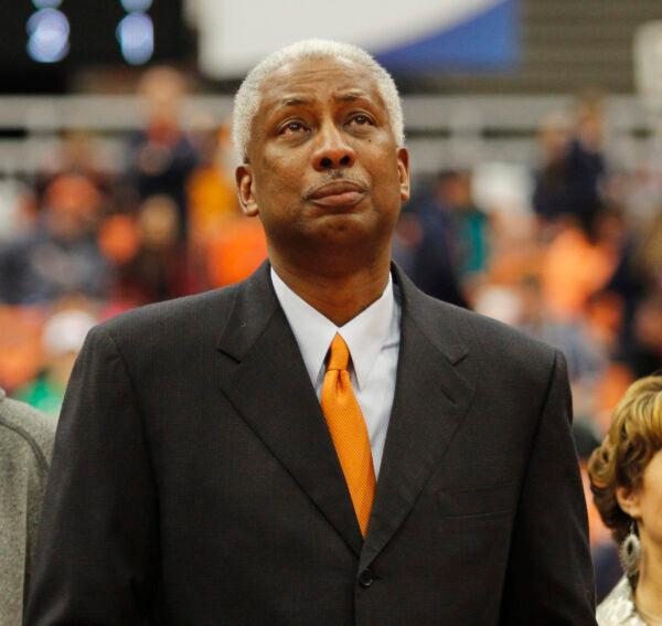 Former Syracuse basketball great Louis Orr watches a video monitor during a ceremony where his jersey was retired at half time of an NCAA college basketball game in Syracuse, N.Y., on Feb. 21, 2015. (Nick Lisi/AP Photo)