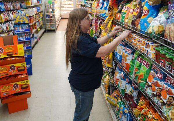 Store Manager Paula Murray at J & D Market in Croswell, Michigan, on Dec. 14, 2022. (Steven Kovac/The Epoch Times)