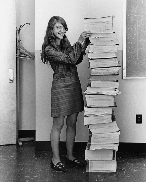 Hamilton stands next to the navigation software that she and her MIT team produced for the Apollo Project, on Jan. 1, 1969. (Public domain)