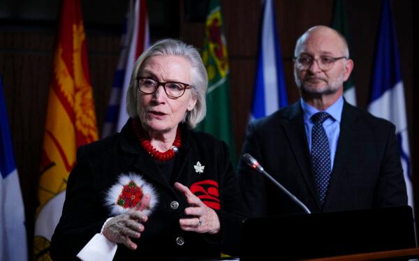 Justice Minister and Attorney General of Canada David Lametti, along with Minister of Mental Health and Addictions and Associate Minister of Health Carolyn Bennett, hold a press conference on Parliament Hill in Ottawa on Dec. 15, 2022. (The Canadian Press/Sean Kilpatrick)