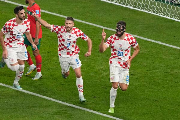 Croatia's Josko Gvardiol, right, celebrates after scoring his side's opening goal during the World Cup third-place playoff soccer match between Croatia and Morocco at Khalifa International Stadium in Doha, Qatar, on Dec. 17, 2022. (Martin Meissner/AP Photo)