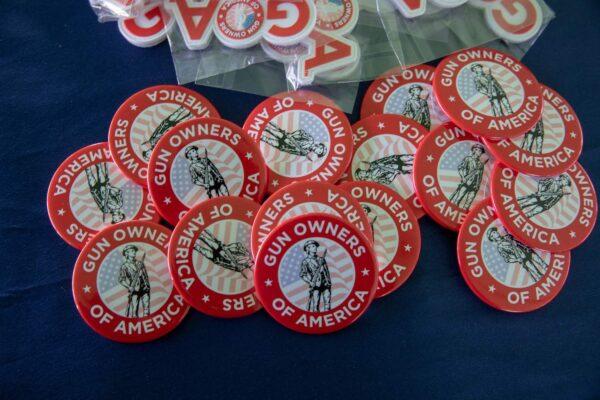 "Gun Owners of America" buttons are sold at the State Capitol in Lansing, Mich., during an annual rally organized by the "Second Amendment March" group on Sept. 27, 2022. (Rebecca Cook/AFP via Getty Images)