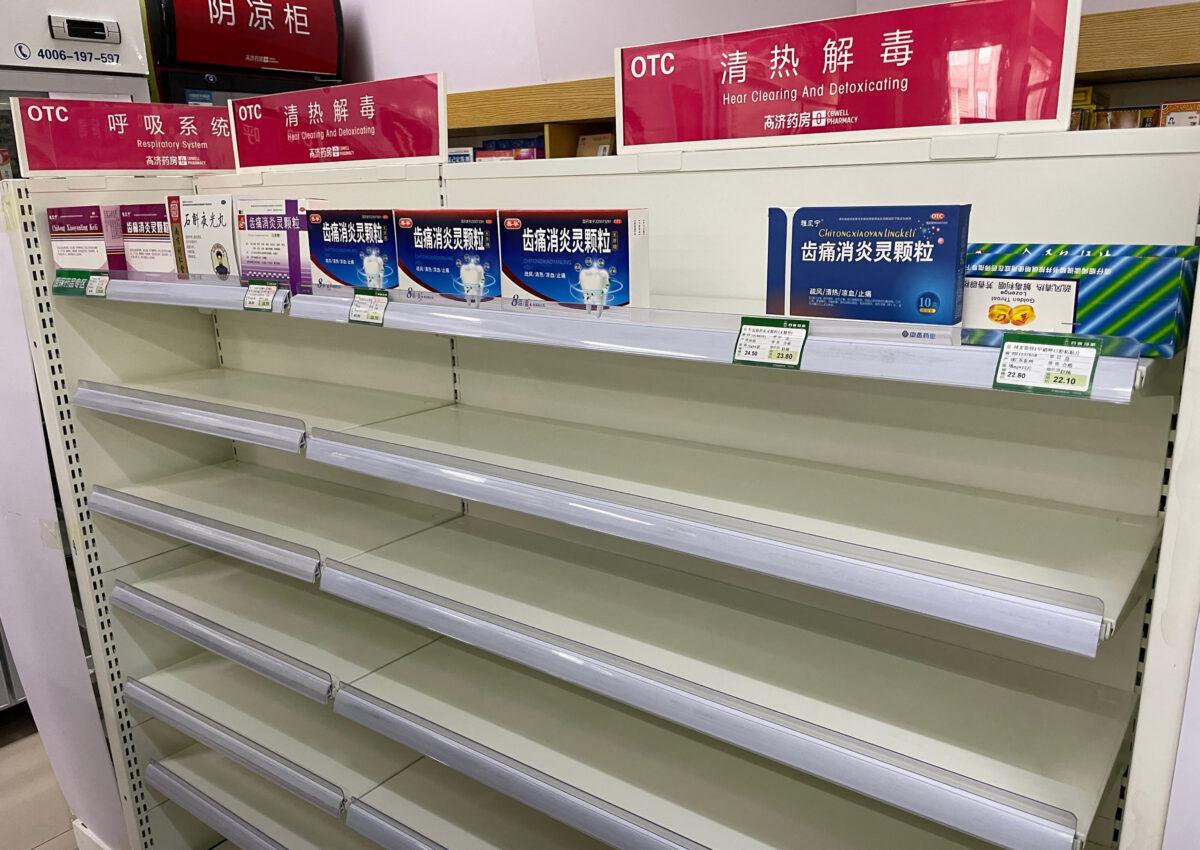An almost empty pharmacy shelf that holds cold medicine, is a consequence of the COVID-19 pandemic in Beijing on December 15, 2022. (Yuxuan Zhang/AFP via Getty Images)
