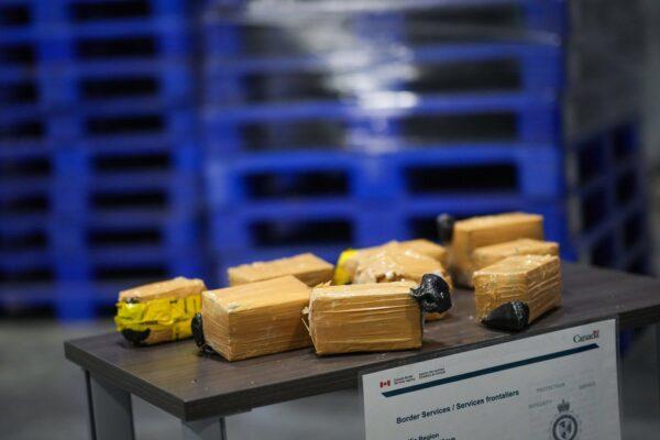 Bricks of seized opium that were concealed in shipping pallets are displayed at a Canada Border Services Agency facility, in Tsawwassen, B.C., on Dec. 16, 2022. (The Canadian Press/Darryl Dyck)