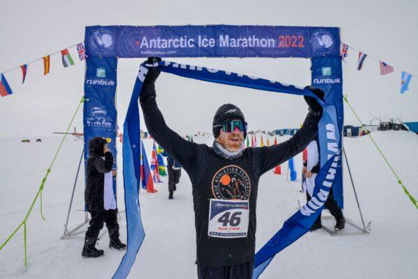 Irish runner Sean Tobin reacts as he wins the Antarctic Ice Marathon, in Union Glacier, Antarctica, on Dec. 14, 2022. (Mark Conlon/Antarctic Ice Marathon/Handout via Reuters)