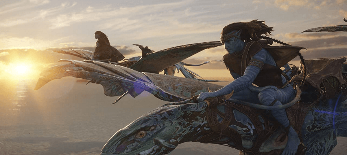 Neytiri (Zoe Saldana) and Jake Sully (Sam Worthington) fleeing their jungle home for an ocean-based lifestyle, in "Avatar: The Way of Water." (20th Century Studios)