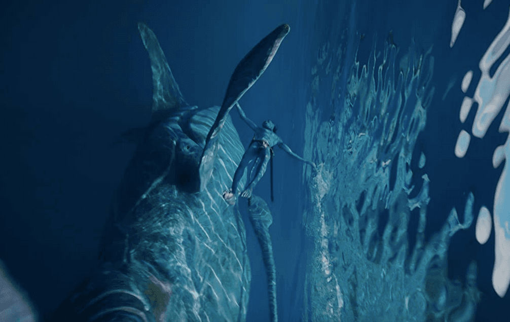 Lo'ak (Britain Dalton) swimming with his giant new whale friend, in "Avatar: The Way of Water." (20th Century Studios)