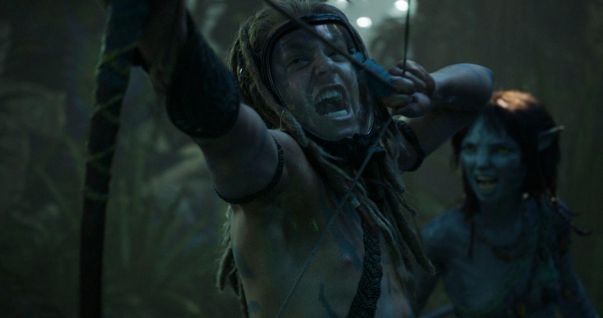 Spider (Jack Champion) and Kiri (Sigourney Weaver) fight the U.S. Marines trying to capture Jake Sully, in "Avatar: The Way of Water." (20th Century Studios)