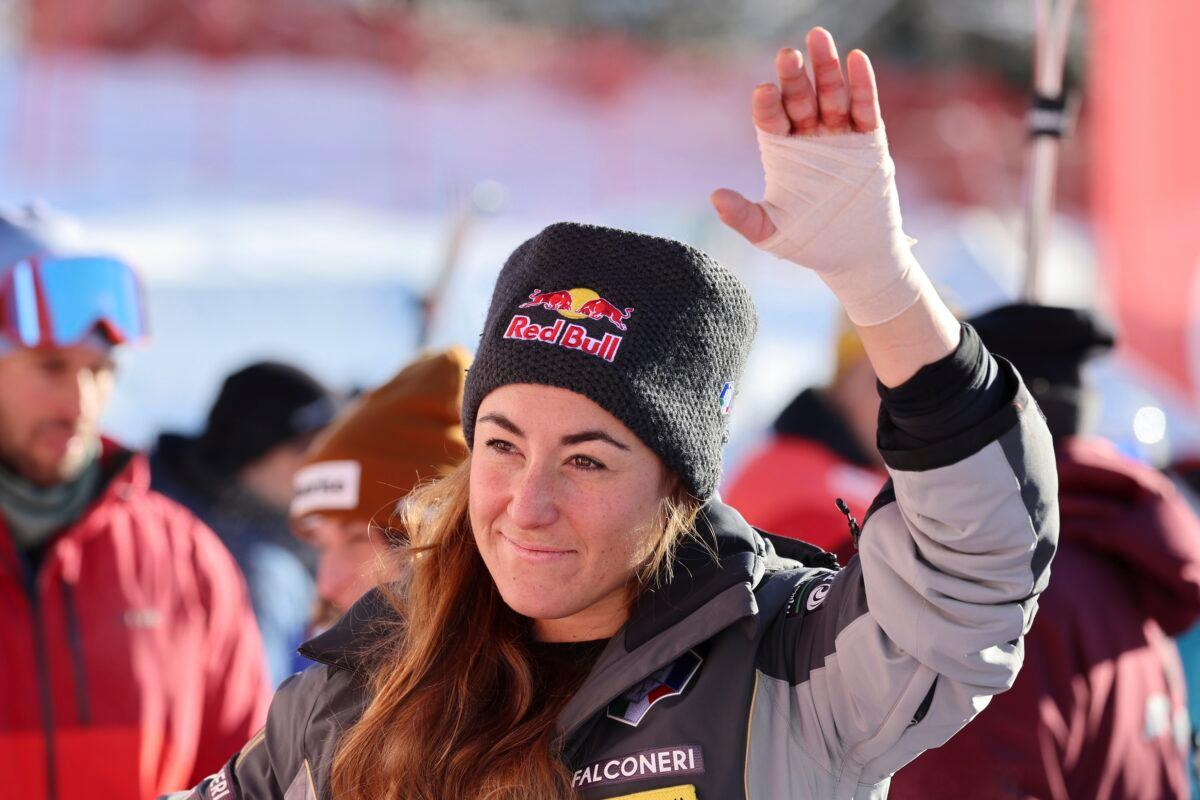 Italy's Sofia Goggia salutes in the finish area after crossing the finish line to win an alpine ski, women's World Cup downhill race, in St. Moritz, Switzerland, on Dec. 17, 2022. (Marco Trovati/AP Photo)