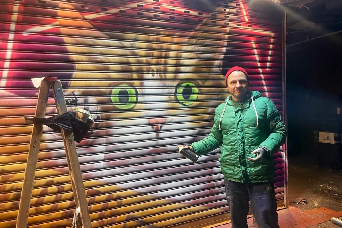 “Mong Kok Cat" painted by Vladi at Kwong Wing Cafe in Mong Kok in Hong Kong on Dec. 15, 2022.
