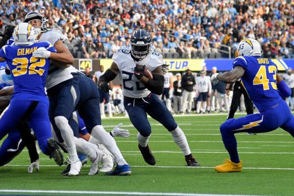 Derrick Henry (22) of the Tennessee Titans runs the ball for a touchdown during the second quarter of the game against the Los Angeles Chargers at SoFi Stadium in Inglewood, Calif., on Dec. 18, 2022. (Kevork Djansezian/Getty Images)