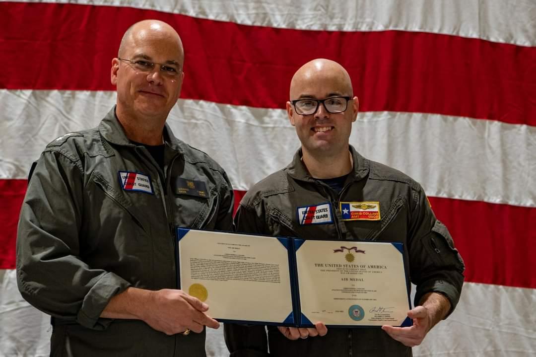 Rear Adm. Richard V. Timme (L) awards Petty Officer Second Class Chris Collins (R) with an Air Medal for his efforts rescuing oil rig workers trapped in a fire in February 2022. (Courtesy of Collins)