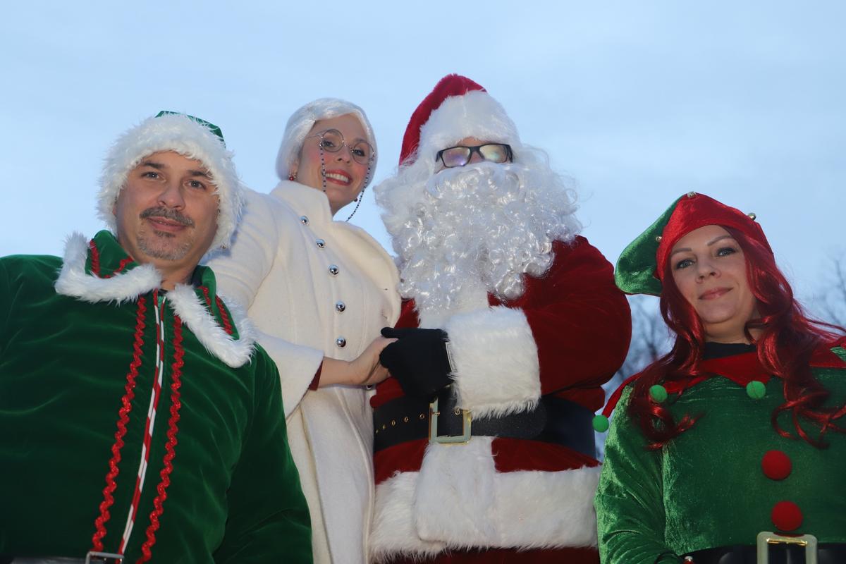 Mrs. Claus next to Santa and a pair of elves during Fredericksburg’s Public Safety Santa Run. (Courtesy of <a href="https://www.facebook.com/FXBGPolice">Fredericksburg Police Department</a>)