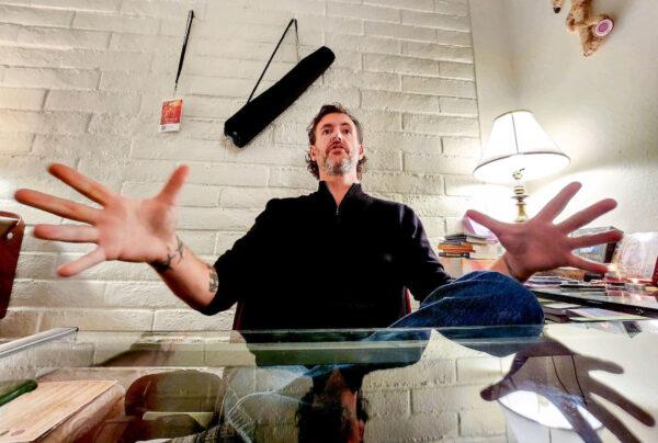 Psychic Charley Lamson said he foresees big changes and many truths revealed in 2023. Here, he sits behind his desk at the Center for the New Age in Sedona, Ariz., on Dec. 7, 2022. (Allan Stein/The Epoch Times)