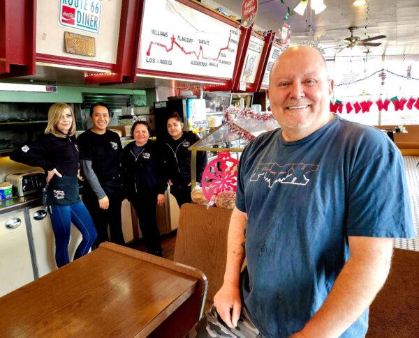 Jeff Pruett, owner of the Route 66 Diner in Williams, Ariz., and his staff get ready for the lunchtime crowd on Dec. 7, 2022. Pruett said it's been a slow year for his business, but help is hard to find. (Allan Stein/The Epoch Times)