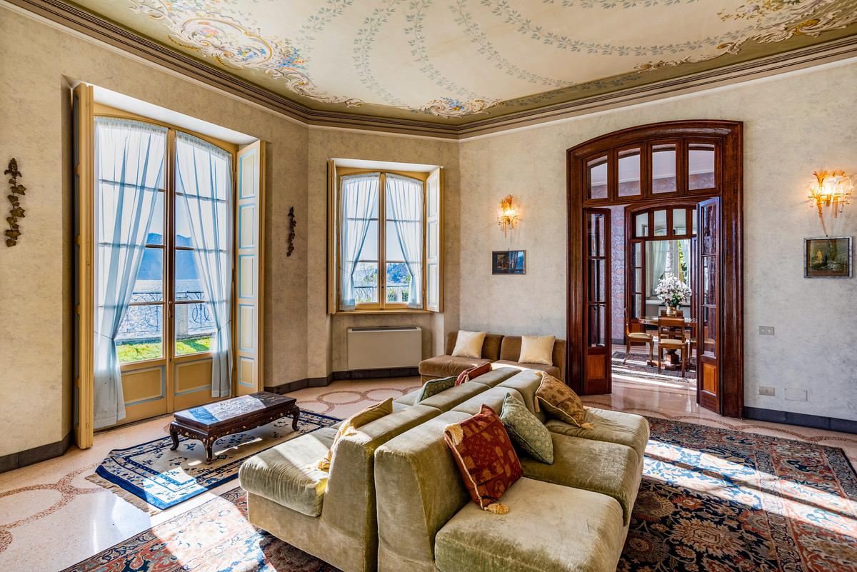 The lush interiors feature well-preserved intricate Art Nouveau decor, accented by the restored original flooring, and antique furnishings. (Courtesy of Italy Sotheby's International Realty)
