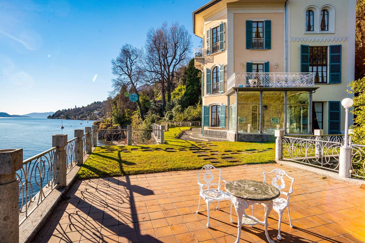 This small terrace overlooking Lake Maggiore is the perfect place to relax and take in the surrounding natural beauty. (Courtesy of Italy Sotheby's International Realty)