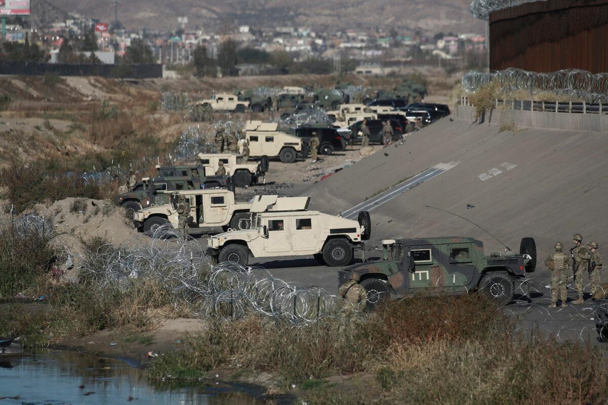 U.S. military guard El Paso's border with Mexico, seen from Ciudad Juarez, Mexico, on Dec. 20, 2022. (Christian Chavez/AP Photo)
