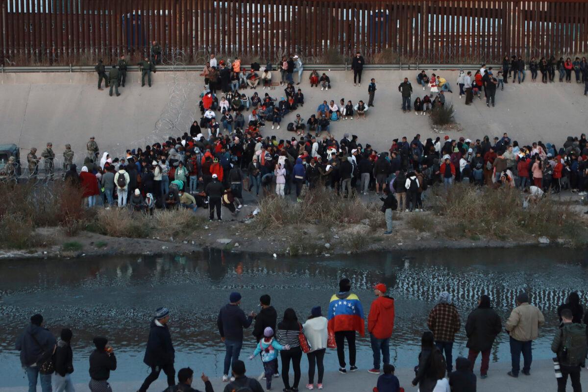 People gather near a crossing into El Paso, Texas, as seen from Ciudad Juarez, Mexico, on Dec. 20, 2022. (Christian Chavez/AP Photo)