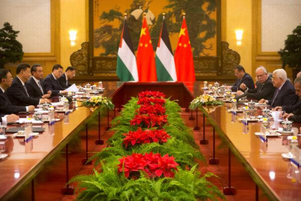 Chinese leader Xi Jinping (L) listens as Palestinian President Mahmoud Abbas (R) speaks during a meeting at the Great Hall of the People in Beijing on July 18, 2017.<br/>Abbas is on an official visit to China from July 17-20. (Mark Schiefelbein/AFP via Getty Images)
